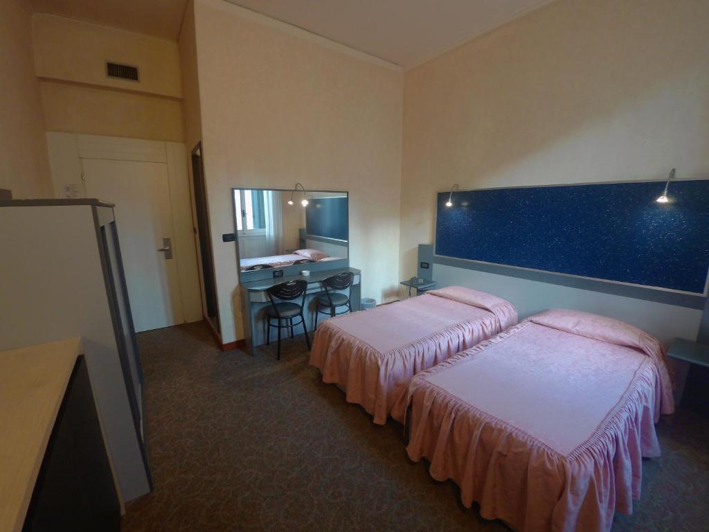 Postel nebo postele na pokoji v ubytování Hotel Ada