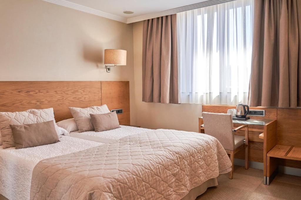 Krevet ili kreveti u jedinici u okviru objekta Hotel San Juan de los Reyes