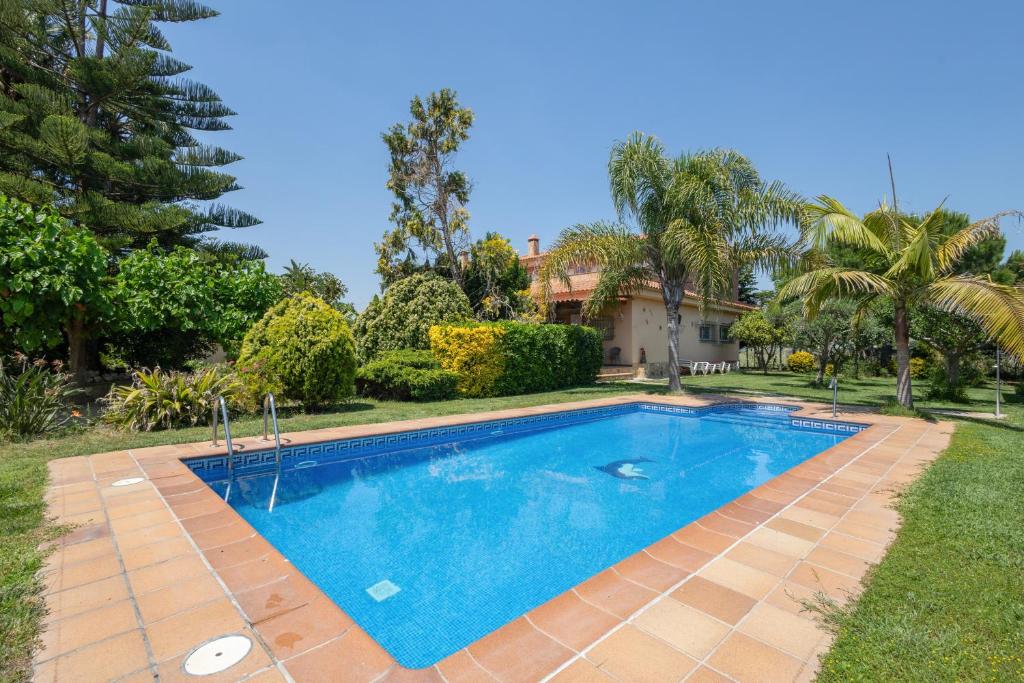 a swimming pool in the yard of a house at Villa Santa Susanna 18 in Santa Susanna