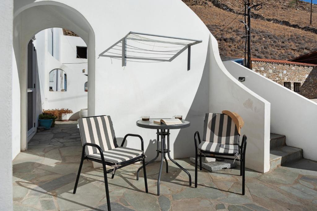 two chairs and a table on a patio at Merichas 7 Irida in Mérikhas