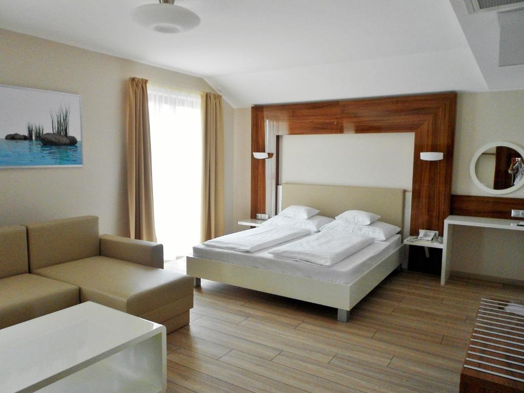 Posteľ alebo postele v izbe v ubytovaní Gokart Hotel