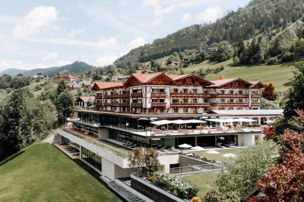 an aerial view of a hotel in the mountains at Hotel Oberforsthof in Sankt Johann im Pongau