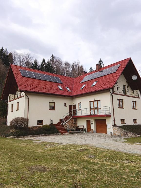 a house with solar panels on the roof at KAJA Zawoja in Zawoja