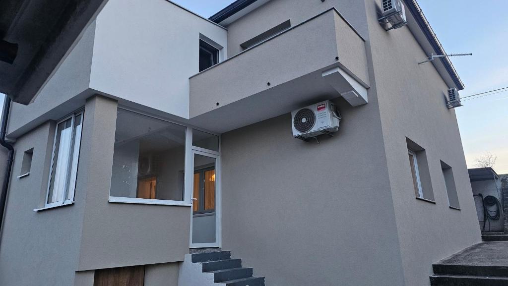 a building with a speaker on the side of it at Apartment 42 in Ljubuški