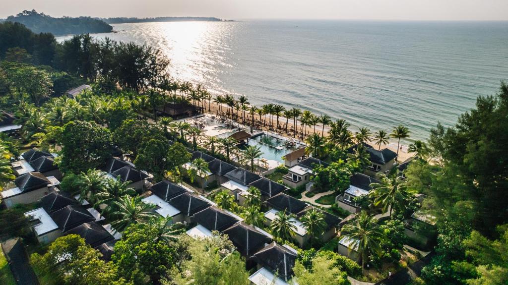 an aerial view of a resort by the water at ananea Beyond Khaolak in Khao Lak