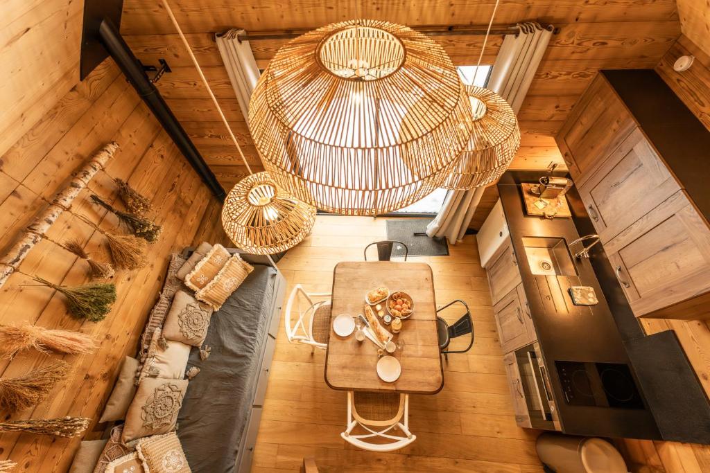 an overhead view of a dining room with a table at Lodge 3 - LE JOLIS CHALETS in Barbey-Séroux