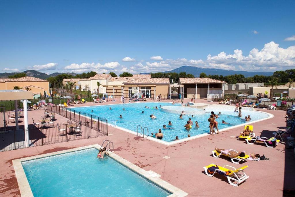a group of people in a pool at a resort at demeure du ventoux in Aubignan