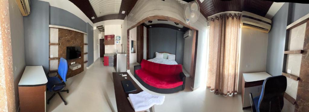 a train room with a bed and a mirror at The Comfort stays gomti nagar in Lucknow