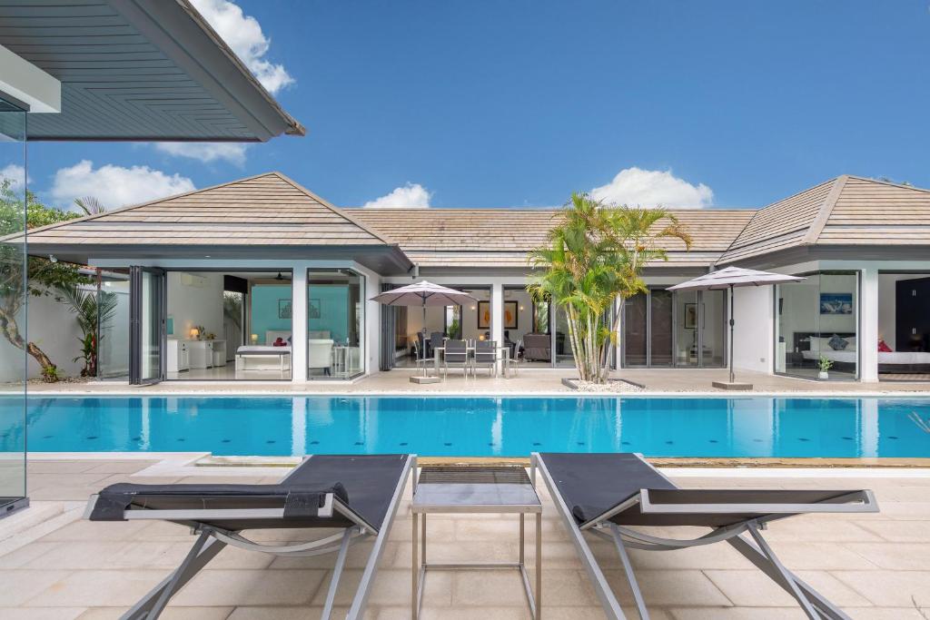 an image of a villa with a swimming pool at 4BR Luxury Pool Retreat - Villa Azura Nai Harn in Nai Harn Beach