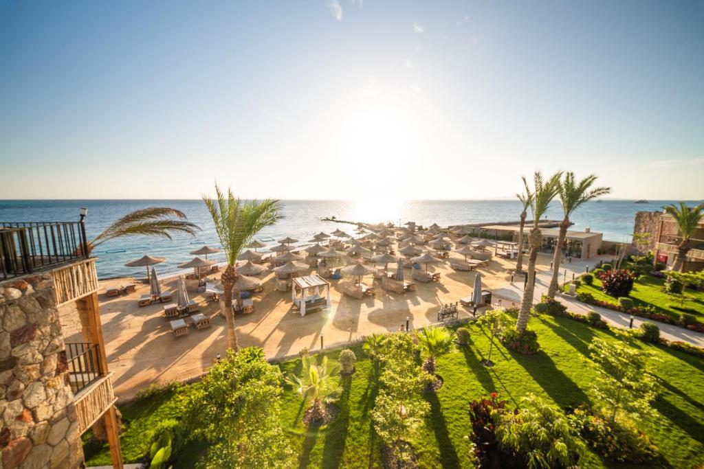 an aerial view of a beach with umbrellas and the ocean at ananea Hurghada - Adults Only in Hurghada
