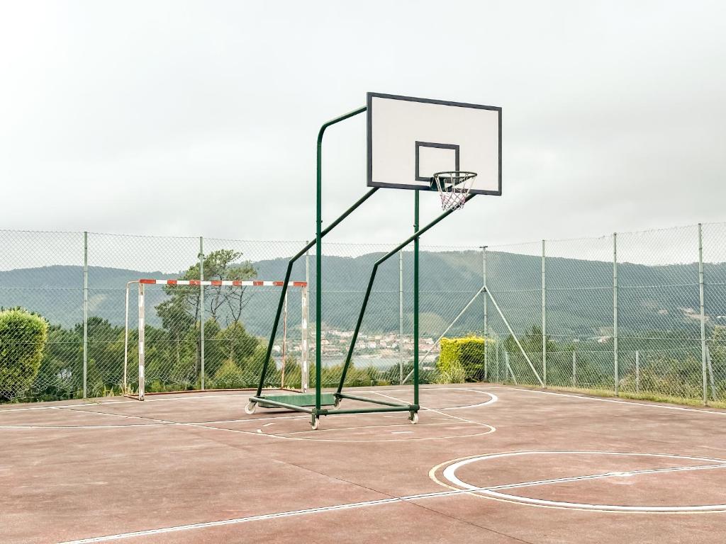 a basketball hoop on a basketball court at Apartamento MN Estorde by ALÔGA in Vilar