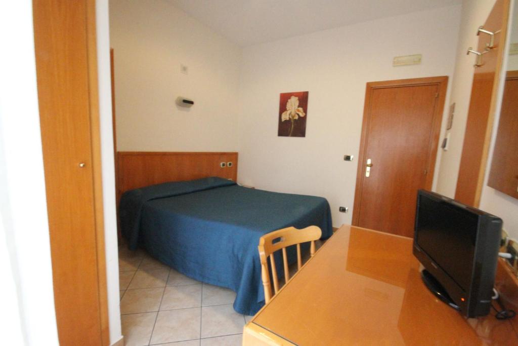 Postel nebo postele na pokoji v ubytování Hotel Zara Napoli