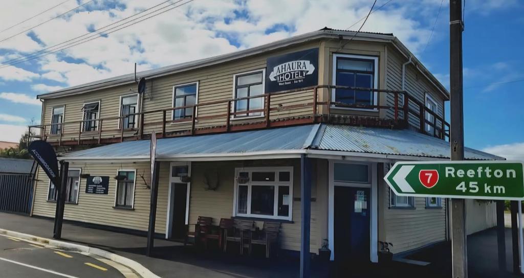 a building on the corner of a street at Ahaura Hotel in Greymouth
