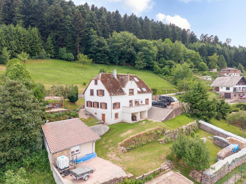 an aerial view of a large white house on a hill at Chez Mémé in Engenthal
