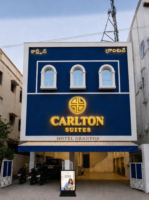 a sign for a carleton suites hotel casino at Hotel Granton By Carlton Suites in Hyderabad