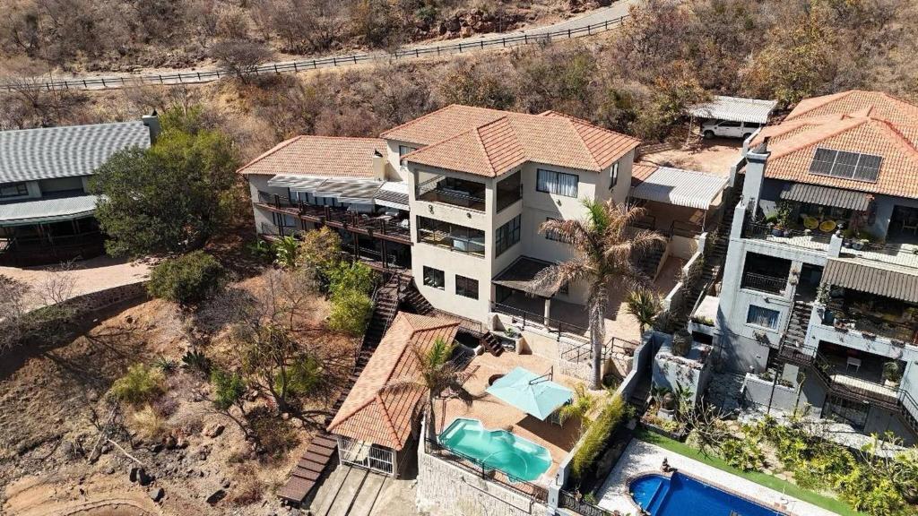 an aerial view of a house with a swimming pool at Khenjadji at Fish Eagle Bay in Bela-Bela
