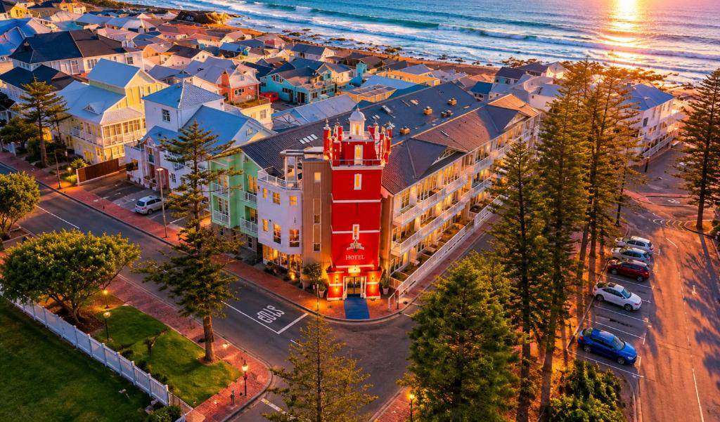 an aerial view of a building with a red tower at Point Village Hotel and Self Catering in Mossel Bay