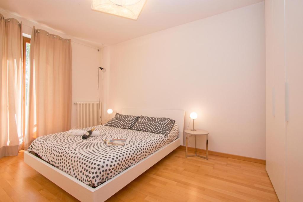 Posteľ alebo postele v izbe v ubytovaní Benacus E4 Apartment by Wonderful Italy
