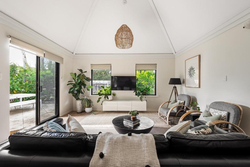 a living room with a couch and a table at Villa 11 Margaret River Beach House in Margaret River Town
