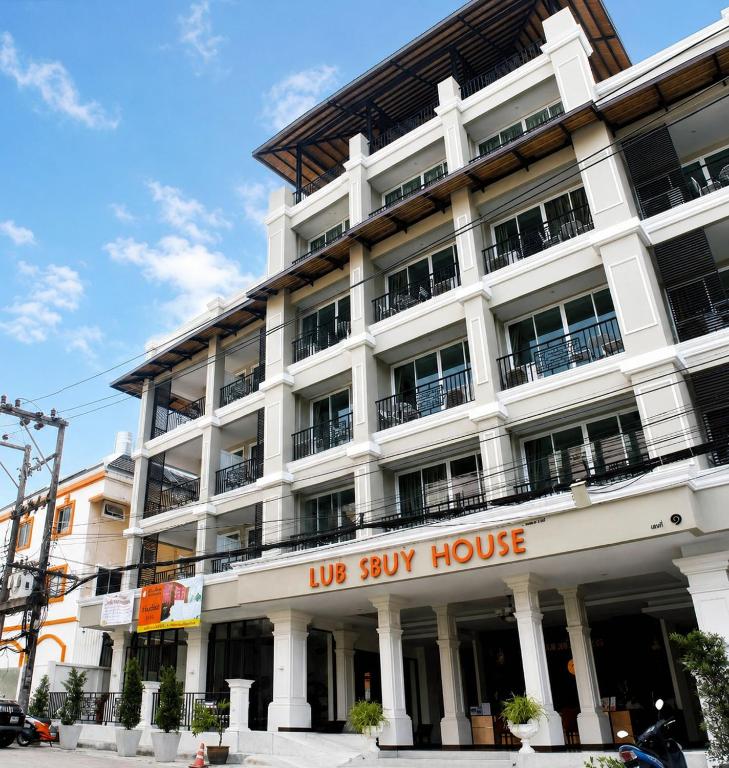 a large white building with a us buy house at Lub Sbuy House Hotel - SHA in Phuket
