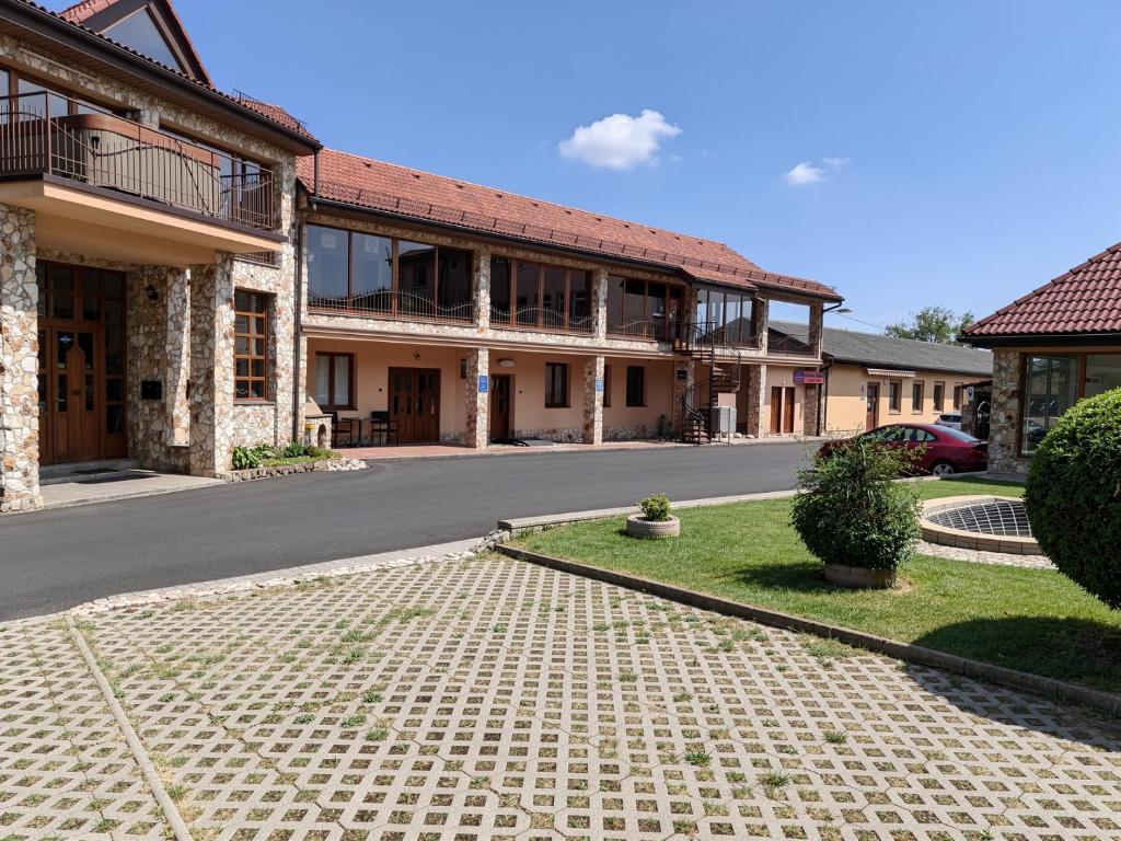 a street in front of a building at Areál SLZA in Sečovce