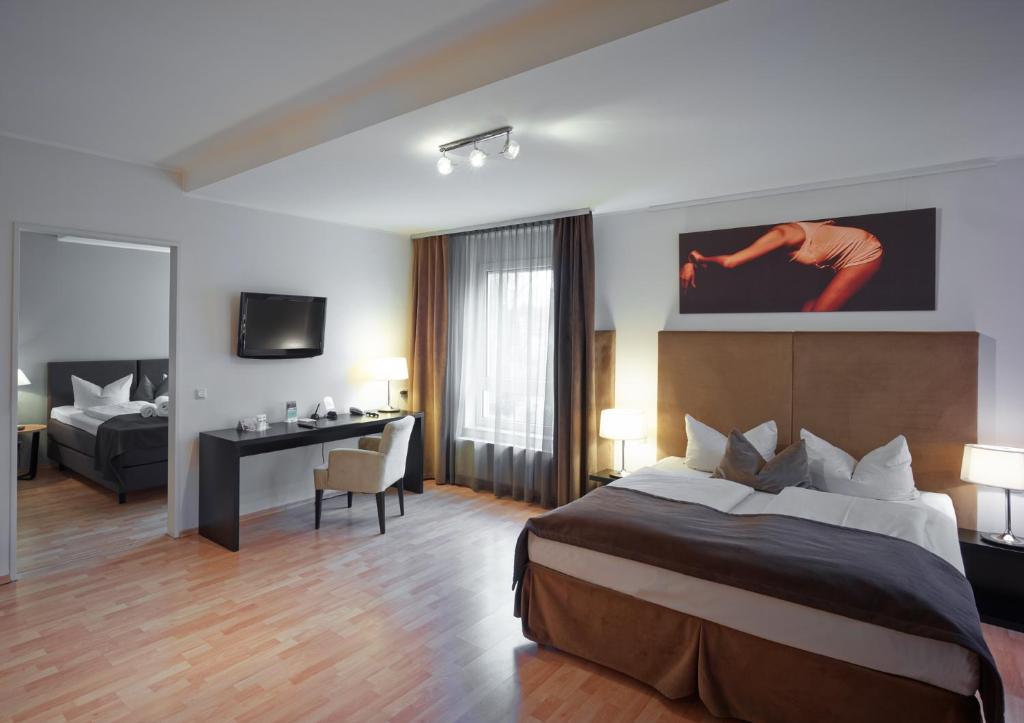 Postel nebo postele na pokoji v ubytování Art Hotel Superior