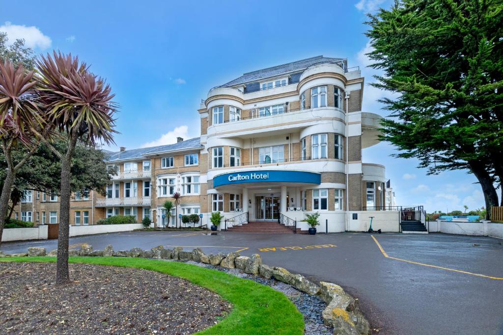 a large building with a parking lot at Bournemouth Carlton Hotel By Sunday in Bournemouth