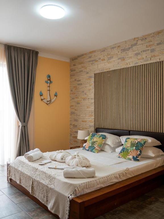 a bedroom with a large bed with towels on it at Hotel Boutique Casa Venusian in Venus