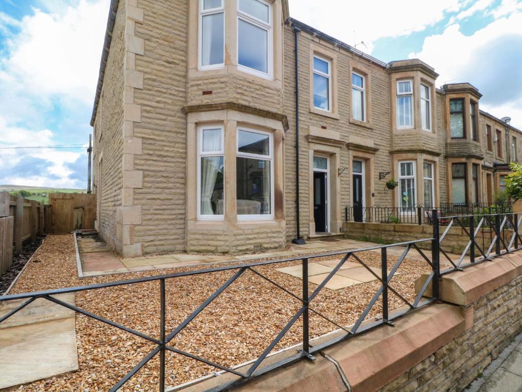 a house with a gate in front of it at 163 Manchester Road in Accrington