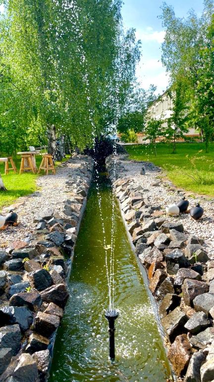 a water feature in the middle of a park at Hostel in Böhlen
