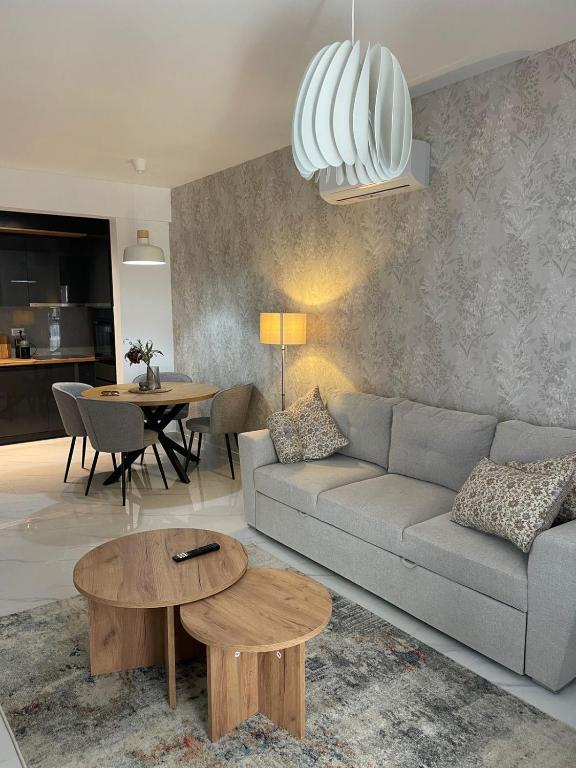 a living room with a couch and a table at Bluvera in Šušanj