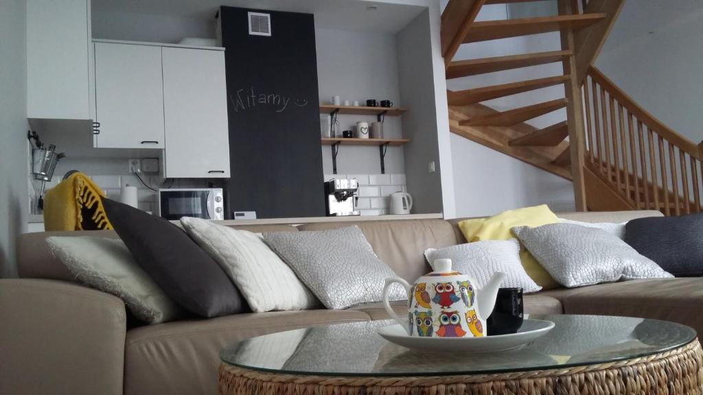 a living room with a couch and a table at Widokówka in Tarnobrzeg
