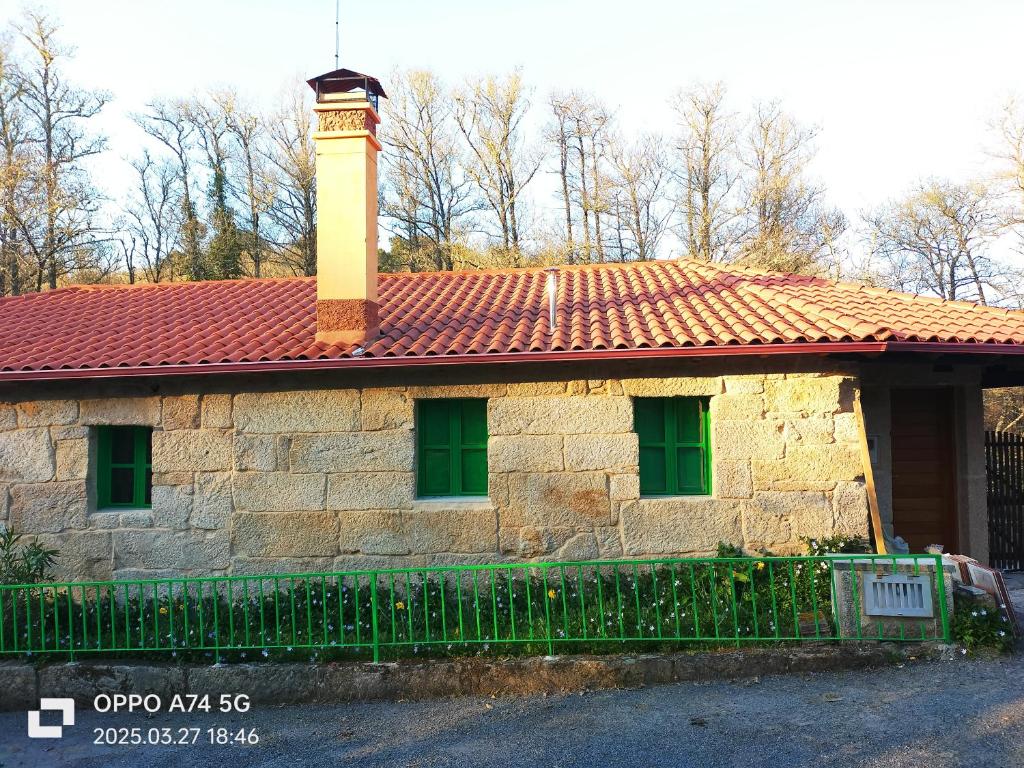 a building with a tower on top of it at Muiño Verde in Loña del Monte