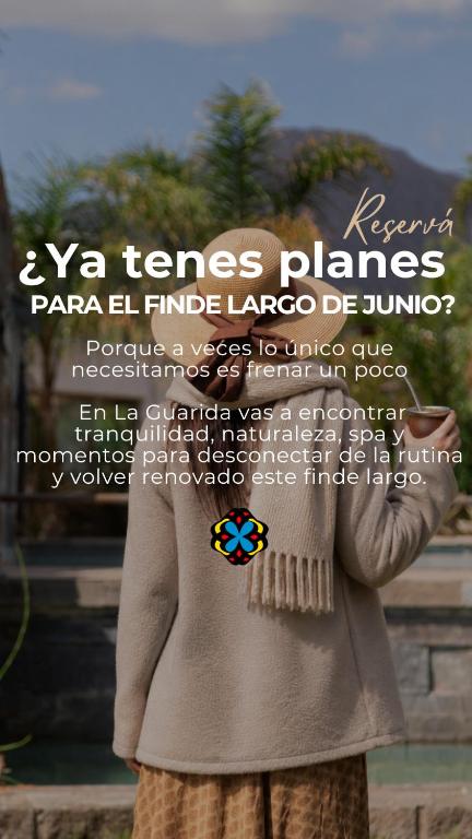 a poster of a woman wearing a coat with a flower at La Guarida Hotel & Spa in Capilla del Monte