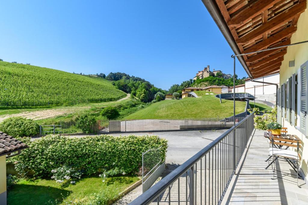 a balcony with a view of a vineyard at Ciabot delle Aie - Barolo in Barolo