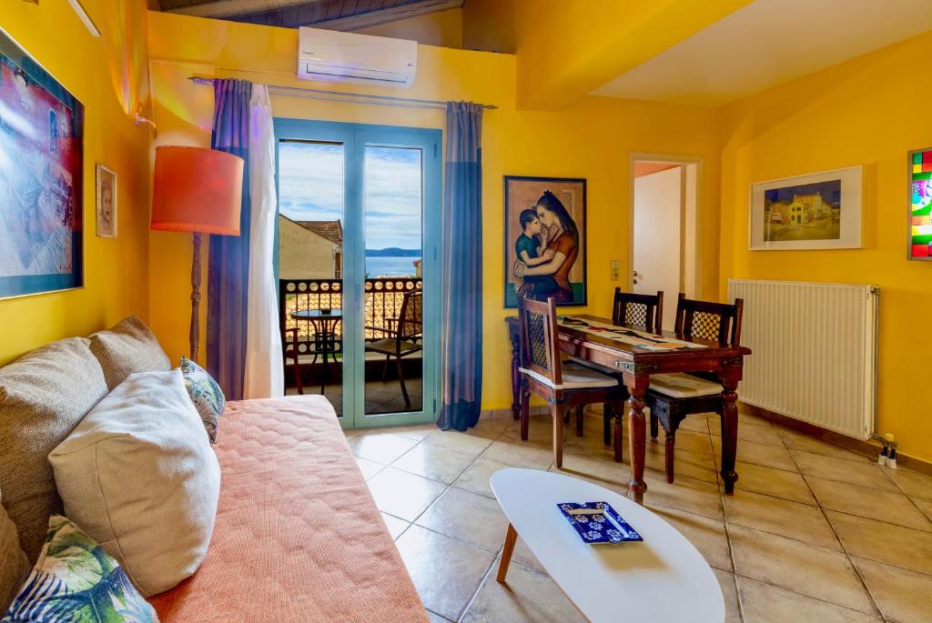 a living room with a couch and a table at Villa Kirki Apartments in Agia Effimia