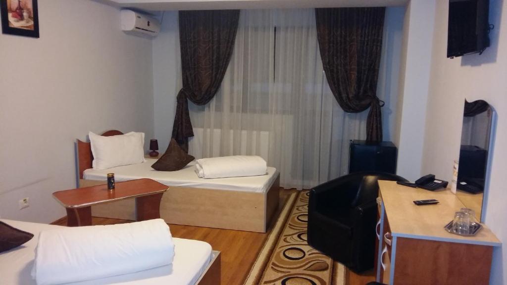 Postel nebo postele na pokoji v ubytování Hotel Corneliuss