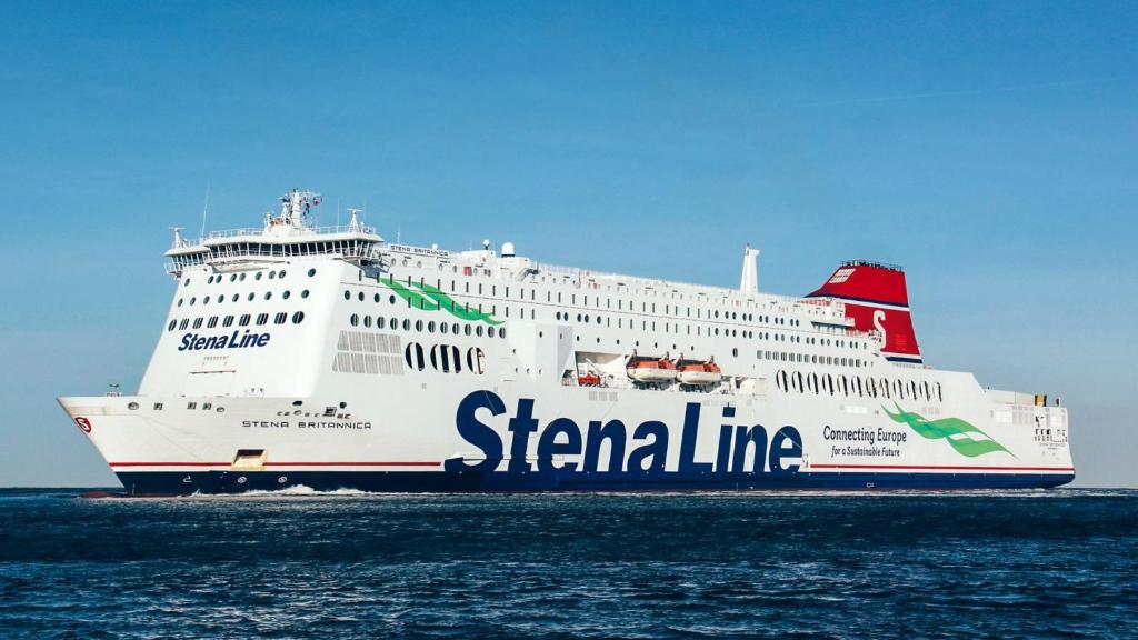 a large white cruise ship in the ocean at FERRY HOUSE stranraer in Stranraer