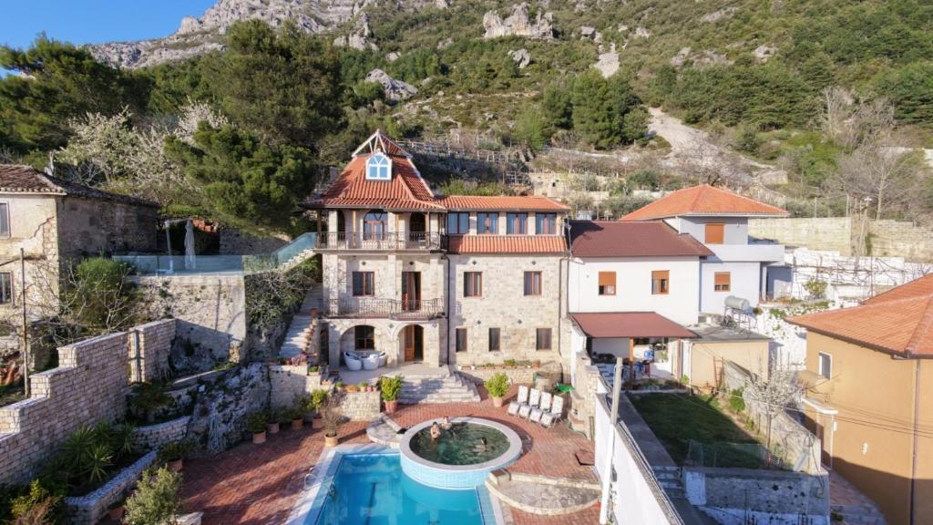 an aerial view of a house with a swimming pool at Villa Celaj “The Castle” in Krujë