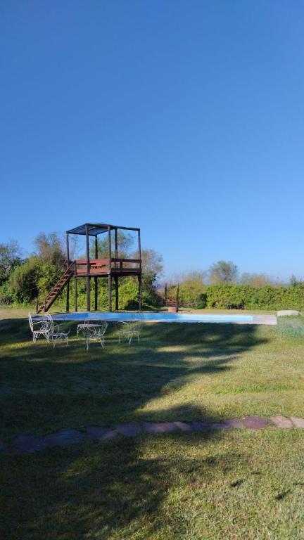 a park with a picnic table and a pool at YPORA Ldg in Colonia Carlos Pellegrini