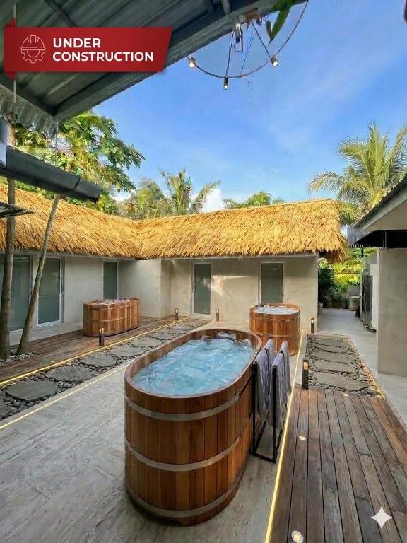 a building with a hot tub in front of it at The Retreat Hotel Wellness & Spa in Krabi