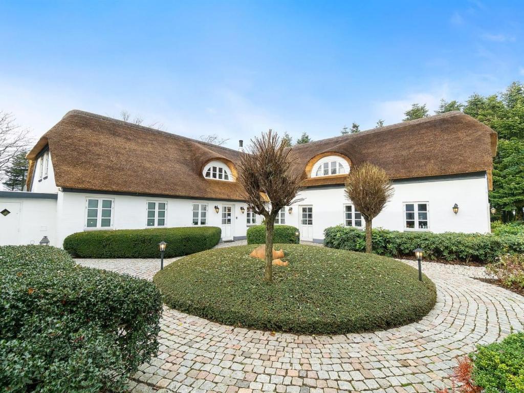 a large white house with a brown roof at Holiday Home Jolanda by Interhome in Bramming