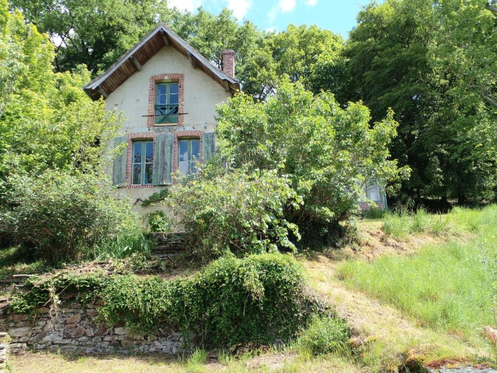 an old house on the side of a hill at Cottage LAISSER VERDURE in Gargilesse-Dampierre