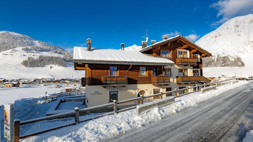a chalet in the mountains in the snow at Chalet Betty in Livigno