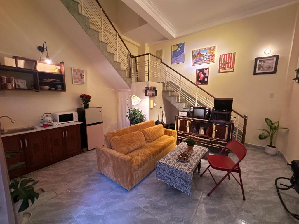 a living room with a couch and a table at The Mê Linh House in Nha Trang