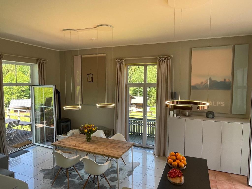 a kitchen with a table and chairs in a room at Chalet Alpenlicht in Oberstdorf