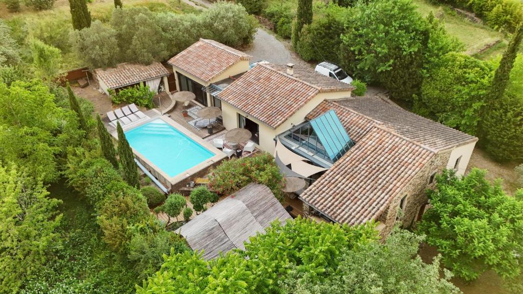 an overhead view of a house with a swimming pool at Les Boissèdes in Les Vans