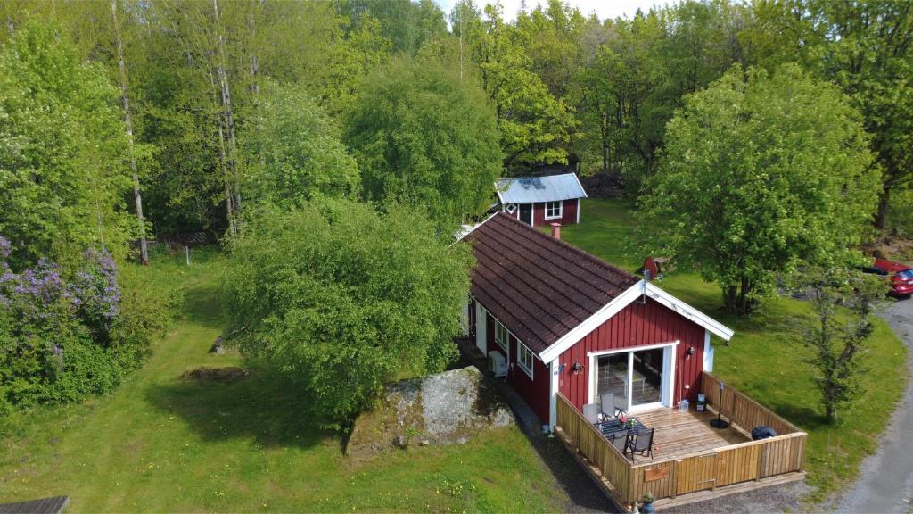an aerial view of a red house with a deck at Hus Rusken in Stockaryd