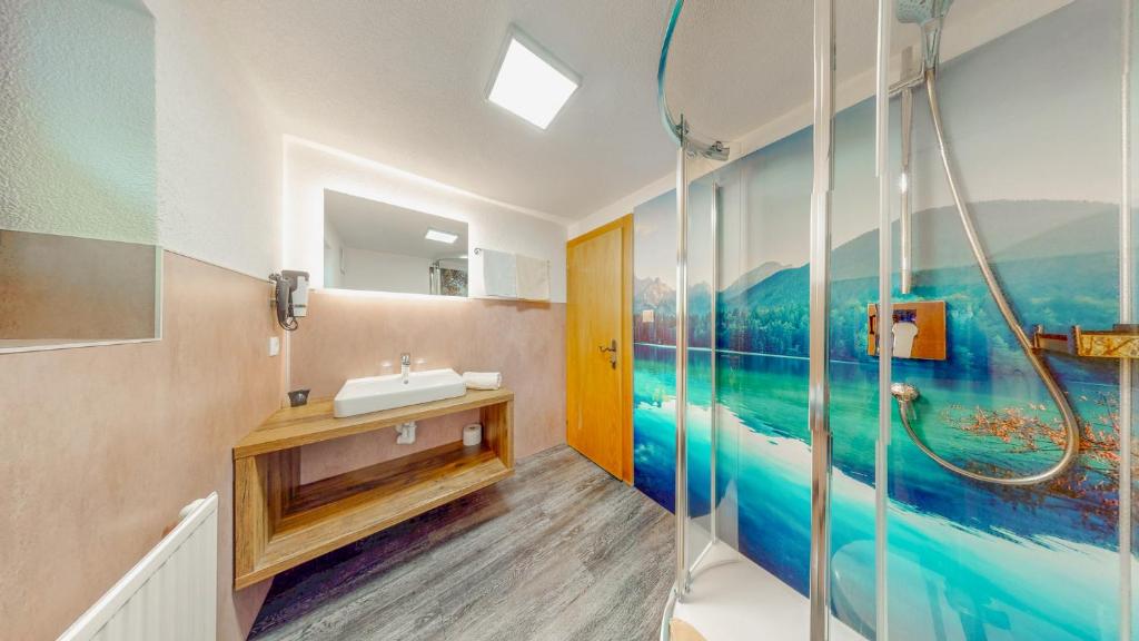 a bathroom with a sink and a shower at Appartement Belmonte in Sölden