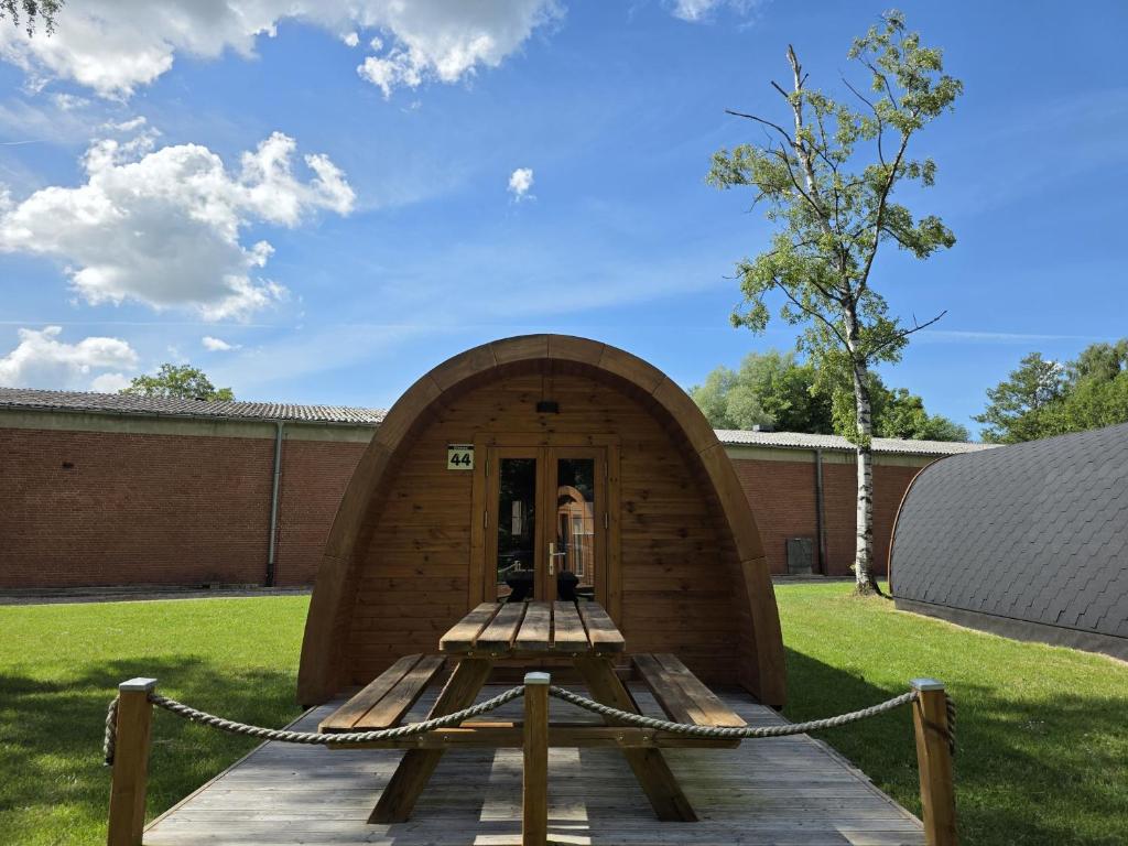 a small building with a chain around it at 44 Camping Pod "Dieksee" in Silberstedt